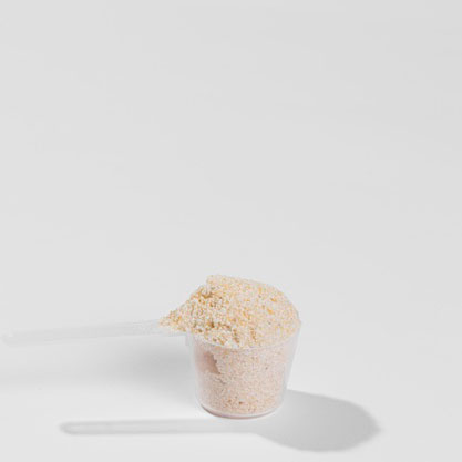 Measuring spoon with sports supplement powder Measuring dosing spoon with sports supplements powder