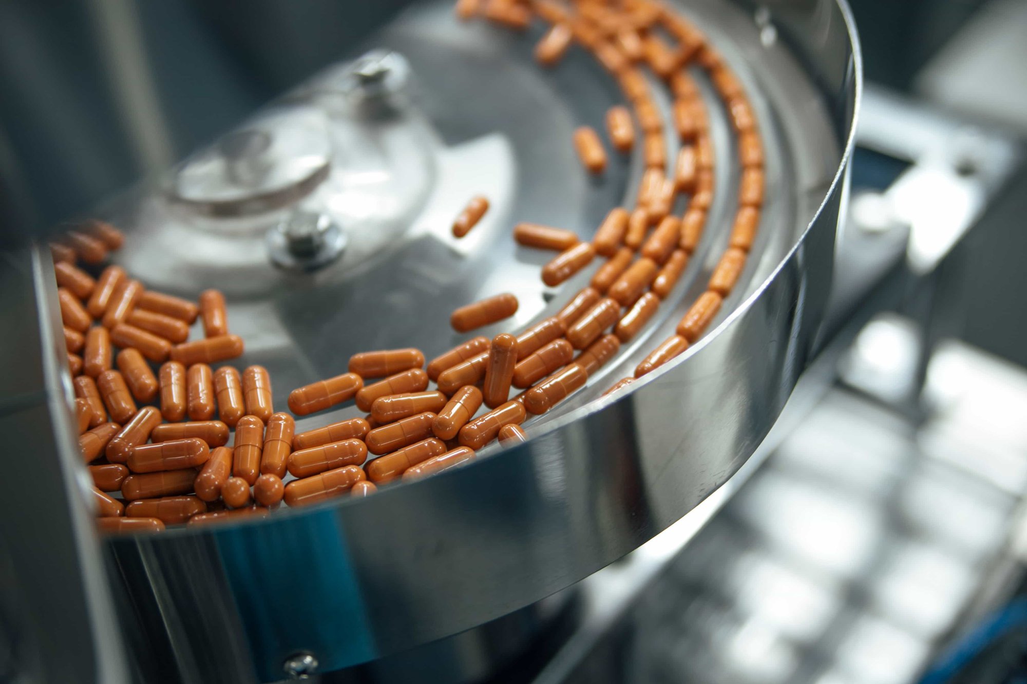 Capsules on the counting and bottle packing machine in the Pharma Manufacture production line