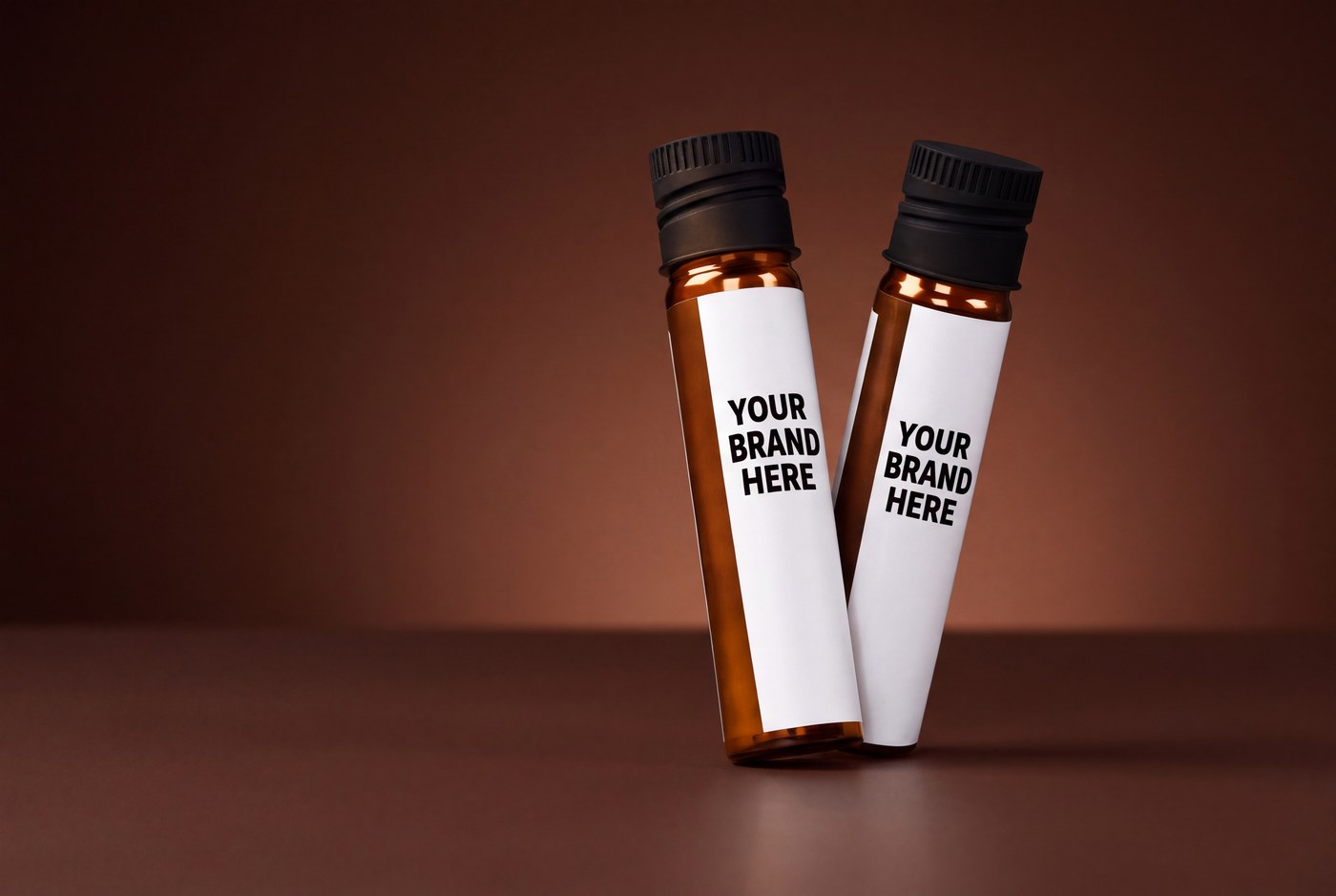 One-serving private label liquid supplement shots in amber glass vials with black screw caps and white wrap-around labels